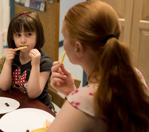 A child and therapist working with food representing feeding therapy offered by feeding therapy provider South Shore Therapies in Southern MA 