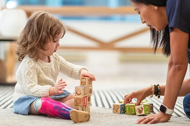 A therapist engaging with a child during a session at South Shore Therapies