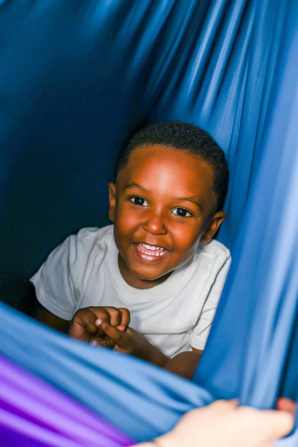 The child is engaging in a therapy session at South Shore Therapies in Norwood, Hingham, and surrounding areas.  